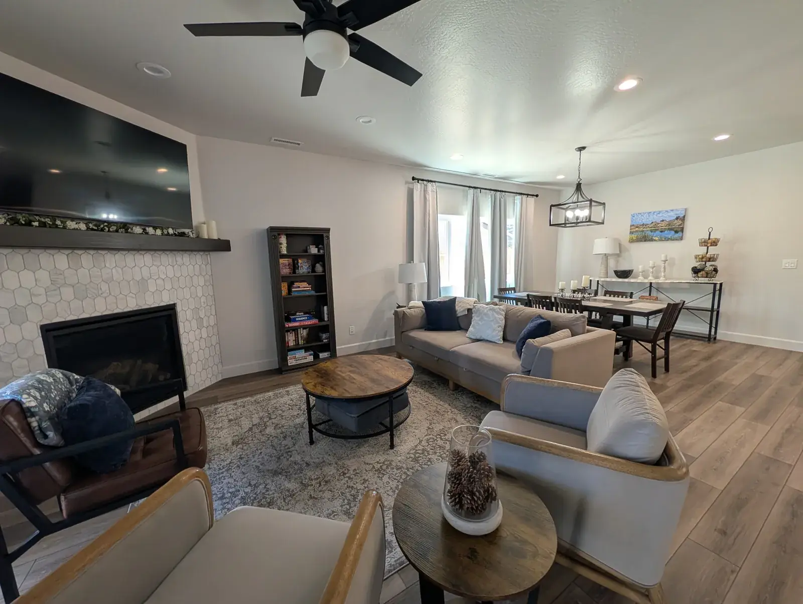 Open great room with stone fireplace in a custom Northern Arizona home