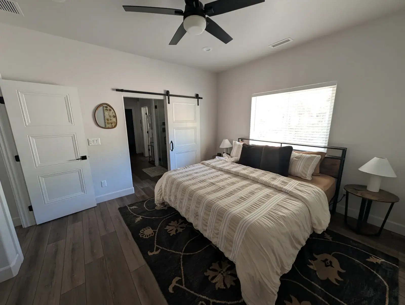 Primary bedroom suite with sliding barn door